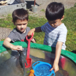 Two boys playing in the water