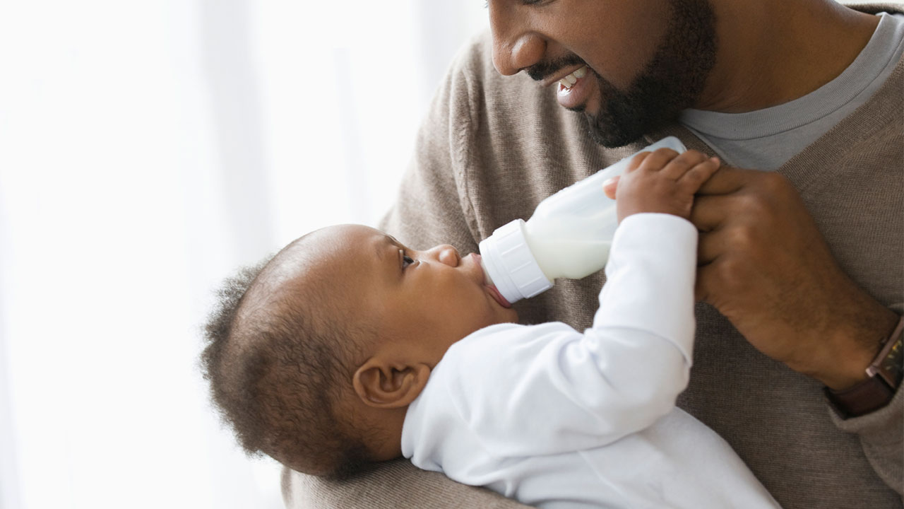 Father feeding child