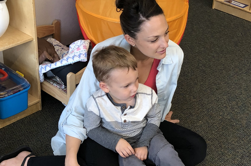 Mom and son listening at circle time