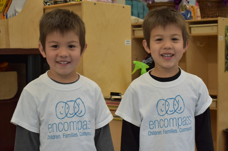 Twin boys wearing Encompass shirts
