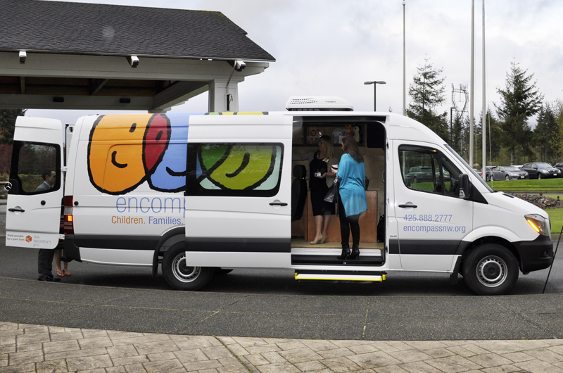 People standing inside the Mobile Therapy Unit