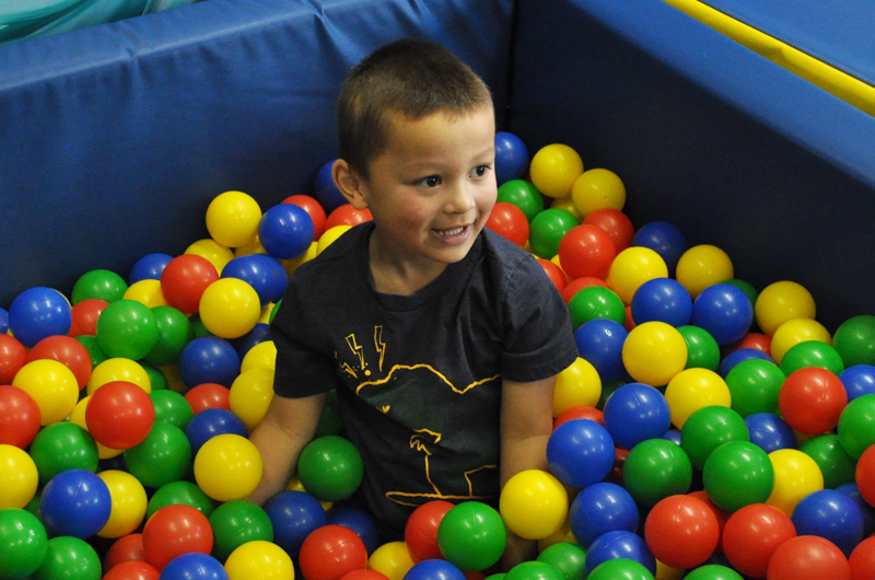 Boy playing in ball pit