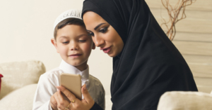 Mom and boy looking at a smartphone