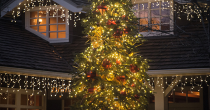 A tree lit up with lights and ornaments