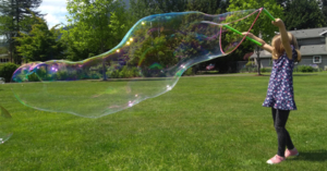 Girl blowing a large bubble
