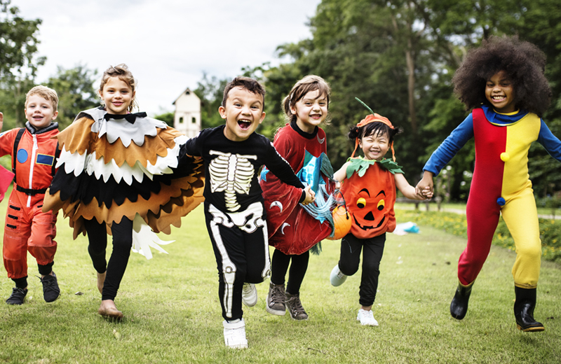 Little kids in Halloween costumes