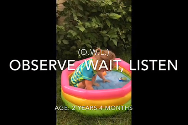 Little girl playing in a kiddie pool