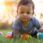 baby crawling in the grass